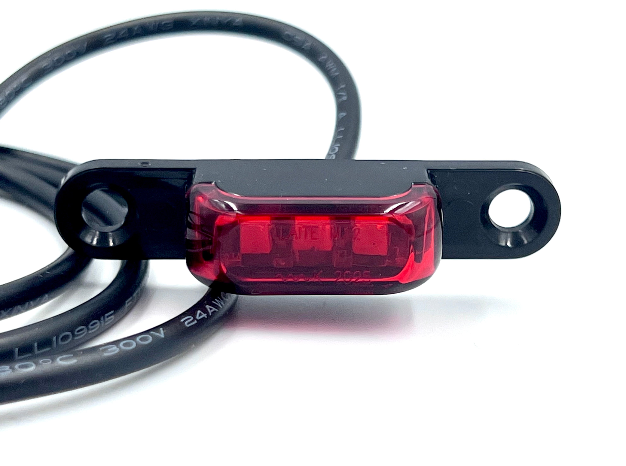 Risers with integrated 12v tail light